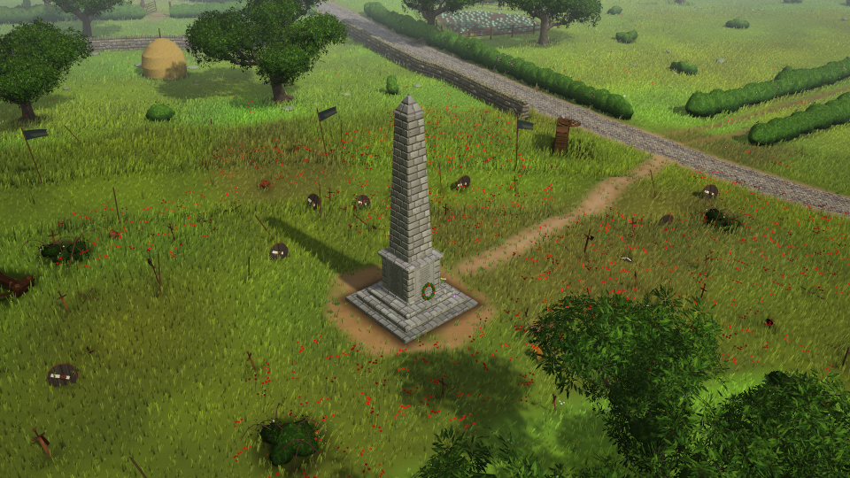 A tall stone memorial standing alone in a field.