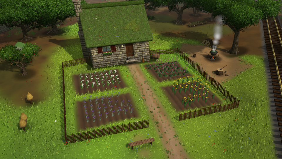 A cottage with a vegetable garden laid out in neat beds.